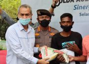 Vaksinasi Massal Kerja Sama Polda Aceh Dan PLN Wilayah Aceh Digelar di Seulimum Sediakan Bansos Dan Token Listrik Untuk Masyarakat
