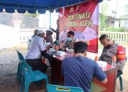 Bidhumas Polda Aceh Berkolaborasi Dengan Ditreskrimum Gelar Vaksinasi di Polsek Darussalam
