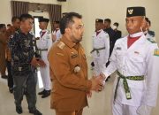 Pj Bupati Aceh Besar Kukuhkan Pasukan Pengibar Bendera Pusaka